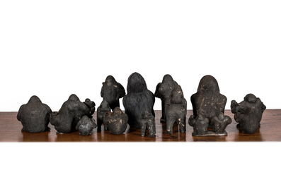 A large collection of wooden and polystone gorilla sculptures, 20th C.