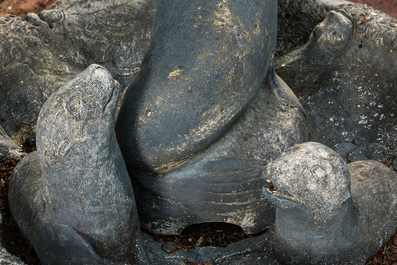 A patinated concrete 'seals and fish' fountain, 20th C.