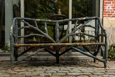 A garden bench in a patinated faux bois structure, 20th C.