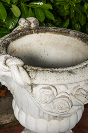 A white painted concrete garden urn on stand, 20th C.