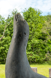 A patinated concrete 'seals and fish' fountain, 20th C.