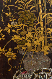 A black lacquered table with polychrome chinoiserie design and mother-of-pearl inlay, ca. 1900