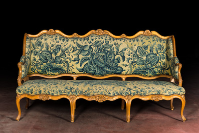 A large French Louis XV beechwooden sofa with embroidered upholstery, 18th C.