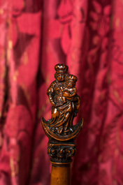 A walnut Madonna and Child on the crescent moon on a Corinthian column, 17/18th C.