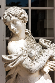 Two large white painted concrete garden statues with allegorical depictions of seasons, 20th C.