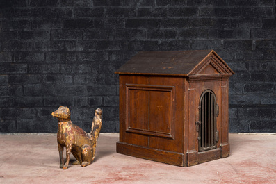 A French wooden doghouse with a gilt wooden dog, 18/19th C.