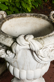 A white painted concrete garden urn on stand, 20th C.