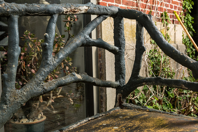 A garden bench in a patinated faux bois structure, 20th C.