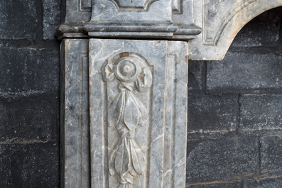 A French Louis XV-style gray marble fireplace with mascaron, 19th C.