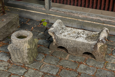 A carved stone double arch-shaped garden ornament and a bird bath, 19th and 20th C.