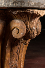 A patinated plaster console with patinated wooden top, 20th C.