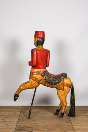 A polychrome wooden carousel horse, 20th C.