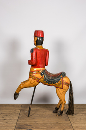 Un cheval de carrousel en bois &agrave; d&eacute;cor polychrome, 20&egrave;me