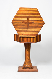 A hexagonal oak wooden and walnut work table on a central base, 19th C.