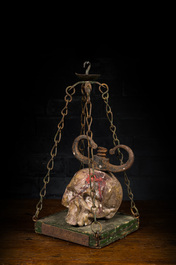 A macabre polychrome wood sculpture with a skull, 19/20th C.