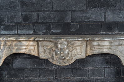 A French Louis XV-style gray marble fireplace with mascaron, 19th C.