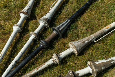 Five patinated wooden lances, 19/20th C.