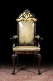An impressive English partly gilt wooden masonic throne chair with leather upholstery, 19th C.
