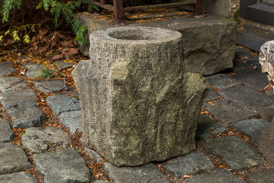 A carved stone double arch-shaped garden ornament and a bird bath, 19th and 20th C.