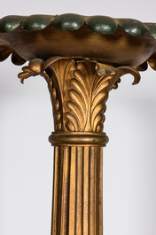 An imposing polychrome and gilt metal candlestick on a wooden base, 20th C.