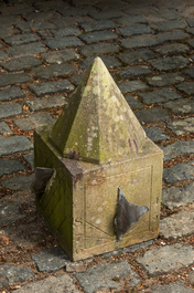 A carved stone sundial with lead indicators, 19th C.