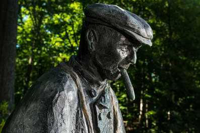 Jan Dekker: 'Fisherman smoking a cigar', a life size patinated bronze sculpture