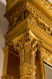 An impressive French Empire-style gilt wooden mirror on faux marble-painted stand, 19th C