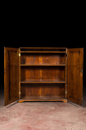 A walnut two-door cupboard, 19th C.