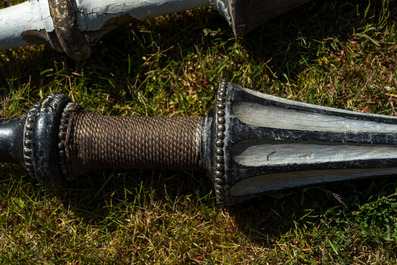 Five patinated wooden lances, 19/20th C.