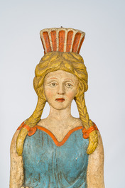 Two polychrome wooden reliefs of Erato holding her lyre and  of a young atlant, 19th C.