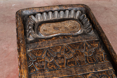 A Bamileke patinated wooden richly decorated bed, Cameroon, 20th C.