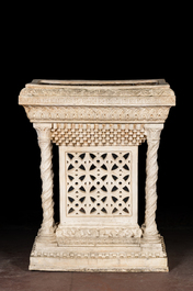 A large white patinated plaster jardini&egrave;re in Romanesque-style, 20th C.