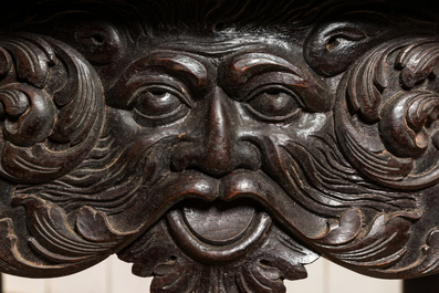 A carved and patinated wooden side table with mascarons in neobaroque-style, 19th C.