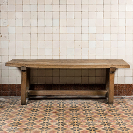 A rural wooden dining table and a bench, 19th C.