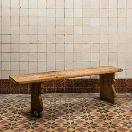 A rural wooden dining table and a bench, 19th C.