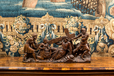 A Flemish carved oak retable fragment depicting the 'Road to Calvary with Saint Veronica', 16th C.