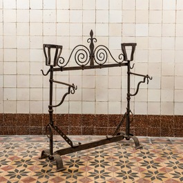 A Gothic Revival wrought iron andiron or firescreen, 19th C.