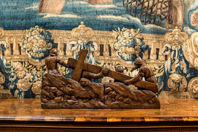 A Flemish carved oak retable fragment depicting the 'Road to Calvary with Saint Veronica', 16th C.