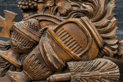 A pair of oak reliefs with Christian symbolism, 18th C.