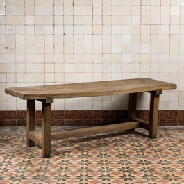 A rural wooden dining table and a bench, 19th C.