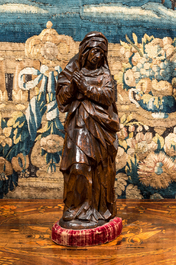 A walnut Virgin from a calvary, Southern Netherlands, 16th C.