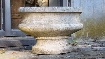 A white stone garden urn and a capital, 19/20th C.