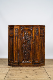 Five richly carved Gothic Revival oak single-door cupboards 19/20th C.