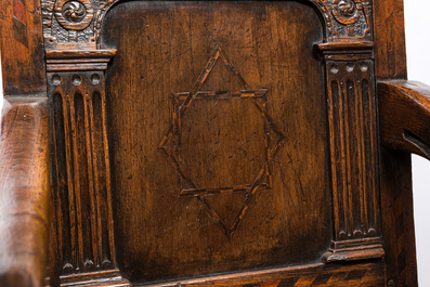 An inlaid carved oak chair with a Star of David, 17th C.