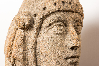 A granite head of a lady wearing a flowery crown, 17th C.