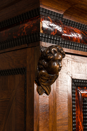 A Flemish wooden two-door cupboard with tortoiseshell and ebonised accents, 17th C. and later