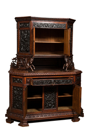 A carved oak buffet with stamped copper panels, 19/20th C.