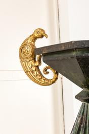 A pair of impressive partly green coloured and gilt wood, dark patinated iron and bronze Art Deco floor lamps, early 20th C.