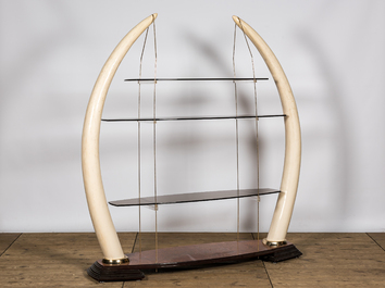 A large &eacute;tag&egrave;re with glass shelves set in faux ivory tusks, 20th C.