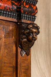 A Flemish wooden two-door cupboard with tortoiseshell and ebonised accents, 17th C. and later